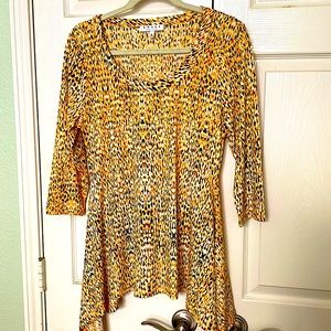 Chaus semi-fitted scoop neck yellow soft knit tunic has  asymmetrical hemline.